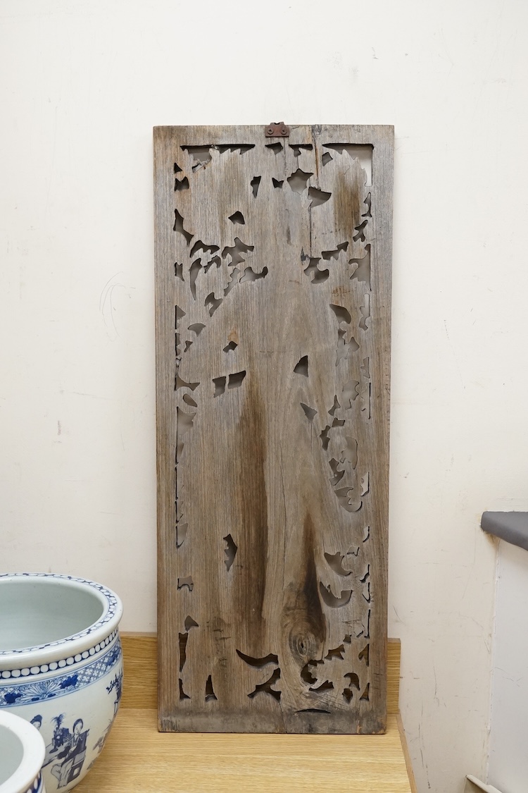 An Asian or Thai carved panel of a deity, 90cm high